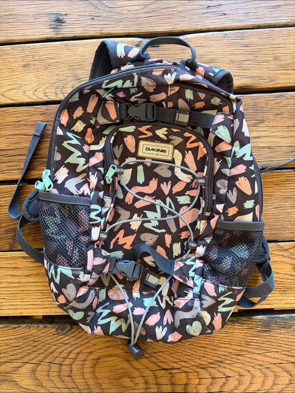 Dakine Kids Backpack in Black with Pastel Pink, Mint, Peach